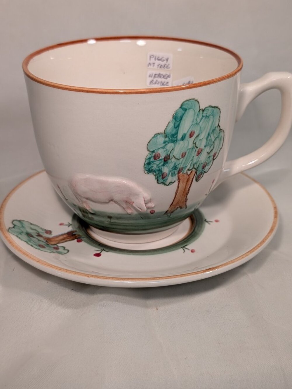 Know a Pig Framer  Christmas Coming !  Cup and Saucer HEBDEN Bridge Pottery